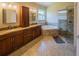Elegant bathroom with double vanity, soaking tub, walk-in shower, and high end finishes at 1450 Chessington Cir, Lake Mary, FL 32746