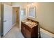 Bathroom featuring a granite countertop vanity and standard-sized toilet at 1450 Chessington Cir, Lake Mary, FL 32746