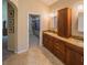 Bathroom vanity with granite countertop, closet, and walk-in closet offer great storage at 1450 Chessington Cir, Lake Mary, FL 32746