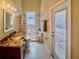 Bathroom with a marble countertop, dual vanity, and a shower with a tub at 1450 Chessington Cir, Lake Mary, FL 32746