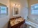 Bathroom featuring a granite countertop vanity and standard-sized toilet at 1450 Chessington Cir, Lake Mary, FL 32746