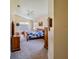 Comfortable bedroom featuring ceiling fan, a dresser and a TV at 1450 Chessington Cir, Lake Mary, FL 32746