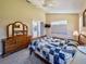 Cozy bedroom with a wooden dresser and sliding glass doors at 1450 Chessington Cir, Lake Mary, FL 32746