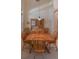 Dining room with wood table, matching chairs, china cabinet, and chandelier creates a warm gathering space at 1450 Chessington Cir, Lake Mary, FL 32746