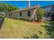 Exterior view showing the side of the house, screened-in pool area, landscaping and backyard at 1450 Chessington Cir, Lake Mary, FL 32746