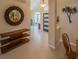 Entryway with tile floors, a decorative wall mirror, a console table, and a view into the light-filled living areas at 1450 Chessington Cir, Lake Mary, FL 32746