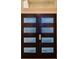Modern front door with four glass inserts at 1450 Chessington Cir, Lake Mary, FL 32746