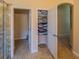 Hallway showing linen closet and doorway, offers a spacious layout and convenient storage at 1450 Chessington Cir, Lake Mary, FL 32746