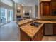 Beautiful kitchen with an island, stainless steel appliances, and seamless flow to the living area at 1450 Chessington Cir, Lake Mary, FL 32746
