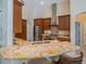 Stylish kitchen with granite countertops, stainless steel appliances, and breakfast bar seating at 1450 Chessington Cir, Lake Mary, FL 32746