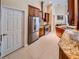 Bright kitchen with stainless steel appliances, granite counters, and ample cabinet space at 1450 Chessington Cir, Lake Mary, FL 32746