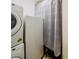 Laundry room featuring modern washer and dryer units, and extra storage space at 1450 Chessington Cir, Lake Mary, FL 32746