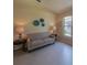 Cozy living room with tile flooring, natural light, a comfortable sofa, and simple decor for a relaxing space at 1450 Chessington Cir, Lake Mary, FL 32746