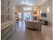 Spacious living room with tile flooring, fireplace, vaulted ceilings, and view of the outdoor patio at 1450 Chessington Cir, Lake Mary, FL 32746