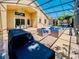 This covered patio features dining and lounge spaces and offers seamless indoor-outdoor living at 1450 Chessington Cir, Lake Mary, FL 32746