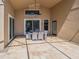 A covered patio featuring an outdoor dining area, perfect for al fresco meals at 1450 Chessington Cir, Lake Mary, FL 32746