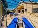 This covered patio includes outdoor lounge furniture, ceiling fan, and access to the backyard at 1450 Chessington Cir, Lake Mary, FL 32746