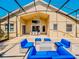 This covered patio features comfortable outdoor seating, ideal for relaxing and entertaining guests at 1450 Chessington Cir, Lake Mary, FL 32746