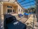 An inviting screened patio includes a full outdoor kitchen and entertainment area at 1450 Chessington Cir, Lake Mary, FL 32746