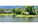 Scenic pond view with a gazebo and lush green landscape in the Heathrow community at 1450 Chessington Cir, Lake Mary, FL 32746