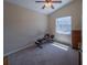 Carpeted room with exercise bench and ceiling fan for a comfortable workout area at 1450 Chessington Cir, Lake Mary, FL 32746
