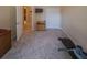 Carpeted room with bench press and storage cabinet offers a customizable space at 1450 Chessington Cir, Lake Mary, FL 32746