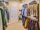 Spacious walk-in closet with ample shelving and rod space for organized storage at 1450 Chessington Cir, Lake Mary, FL 32746