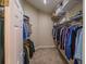 Walk-in closet with clothes rack provides ample storage and organization at 1450 Chessington Cir, Lake Mary, FL 32746