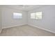 This bedroom features light tile floors and two windows with blinds at 1475 Lowrie Ave, Orlando, FL 32805