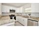 Well-lit kitchen featuring granite countertops, stainless steel appliances and ample cabinet space at 1475 Lowrie Ave, Orlando, FL 32805