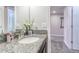 Bathroom featuring granite countertop, white sink, neutral paint and carpet at 1628 Moon Valley Dr, Davenport, FL 33896