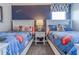 A bedroom featuring twin beds with Disney-themed bedding and a dark blue accent wall at 1628 Moon Valley Dr, Davenport, FL 33896