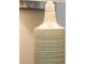 Decor with an artistic lamp with dark stripes along the cylindrical structure at 1628 Moon Valley Dr, Davenport, FL 33896