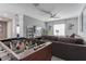 Recreational room with foosball table and living room with sofa and entertainment center at 1628 Moon Valley Dr, Davenport, FL 33896