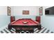 Game room with a red pool table, bar seating, and unique decor at 1628 Moon Valley Dr, Davenport, FL 33896