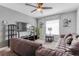 Living room featuring a plush sofa, entertainment center, and natural lighting at 1628 Moon Valley Dr, Davenport, FL 33896