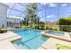 Sparkling pool and spa in a screened enclosure with lush landscaping, perfect for outdoor fun at 1628 Moon Valley Dr, Davenport, FL 33896