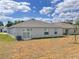 Home's backyard, showcasing its layout and potential for outdoor activities and gardening at 1721 Teagan Ln, Winter Haven, FL 33884