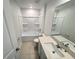 Bathroom with shower/tub, toilet, vanity, and a large mirror at 1721 Teagan Ln, Winter Haven, FL 33884