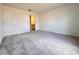 An empty bedroom featuring neutral walls and carpet flooring at 1721 Teagan Ln, Winter Haven, FL 33884