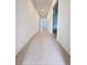 Bright hallway with tile floors, connecting various parts of the home with recessed lighting at 1721 Teagan Ln, Winter Haven, FL 33884