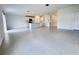 Spacious living room featuring tiled floors with an eat-in kitchen and plenty of natural light at 1721 Teagan Ln, Winter Haven, FL 33884