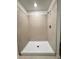 Bathroom features tiled walk-in shower with white shower base and chrome fixtures at 1721 Teagan Ln, Winter Haven, FL 33884
