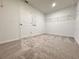A walk-in closet featuring neutral walls, carpet flooring, and a shelving unit at 1721 Teagan Ln, Winter Haven, FL 33884