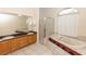 Luxurious bathroom with double vanity, soaking tub, separate shower, and bright window at 19261 Quarterly Pkwy, Orlando, FL 32833