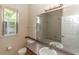 Well-lit bathroom with tan tiling in the shower and a large mirror at 19261 Quarterly Pkwy, Orlando, FL 32833