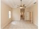 Bright bedroom with tray ceiling, tiled floor, and neutral walls for versatile decor options at 19261 Quarterly Pkwy, Orlando, FL 32833