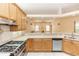 Well-equipped kitchen with stainless steel appliances, stone countertops, and an open layout at 19261 Quarterly Pkwy, Orlando, FL 32833