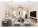 Bright living room featuring neutral tones, stylish furnishings, a ceiling fan, and plenty of natural light at 19261 Quarterly Pkwy, Orlando, FL 32833