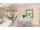 Open-concept living space with modern decor, dining area, a cozy living room, and abundant natural light at 19261 Quarterly Pkwy, Orlando, FL 32833